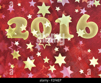 2016 on a piece of red fabric  with golden stars Stock Photo