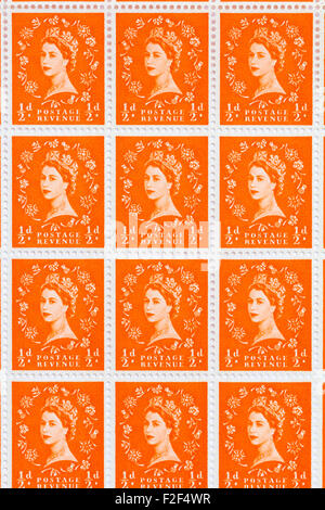 Sheet of 1950's British Royal Mail ½d orange postage stamps from the Wildings definitive issue with portrait of Queen Elizabeth II. Stock Photo