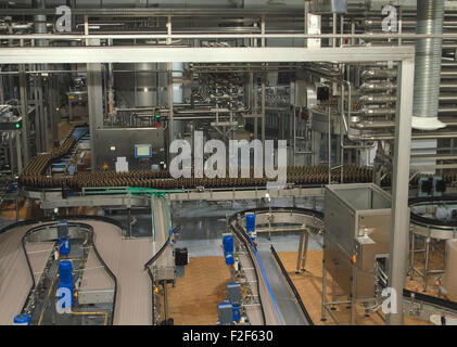 Plastic water bottles on conveyor Stock Photo