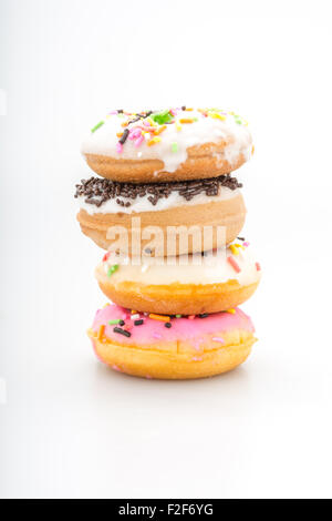 Fresh homemade colorful donuts with icing glaze delicious on white background Stock Photo