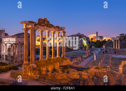 The columns are the ruins of The Temple of Saturn, a temple to the god Saturn in the Roman Forum  Rome Lazio  Italy EU Europe Stock Photo