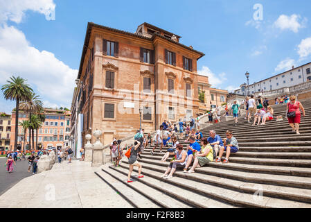 Tourists sitting down on and walking up The Spanish Steps Piazza di spagna Roma Rome lazio Italy EU Europe Stock Photo