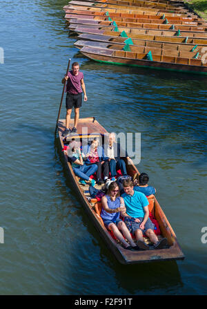 Tourists on a punt trip along the River Cam viewed from the Garret Hostel Bridge, The Backs, Cambridge, England, UK Tourists on a punt trip along the River Cam viewed from the Garret Hostel Bridge, The Backs, Cambridge, England, UK