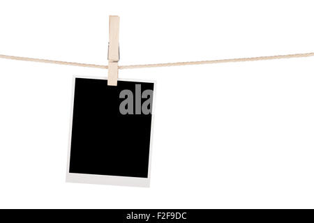 Blank photo hanging on clothesline. Isolated on white background Stock Photo