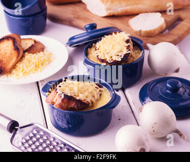 The preparation of a traditional French onion soup. Selective focus. Stock Photo