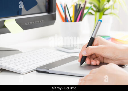 Graphic designer at work. Color swatch samples. Stock Photo