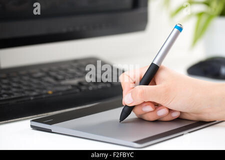 Graphic designer at work. Color swatch samples. Stock Photo