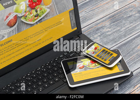 Responsive web design on mobile devices phone, laptop and tablet pc Stock Photo