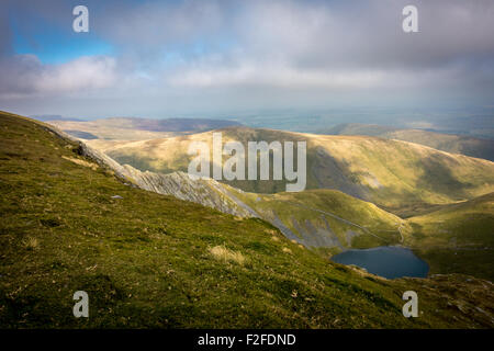 Looking over Scales Tarn and the scramble of Sharp Edge ridge on Blencathra, Lake District Stock Photo