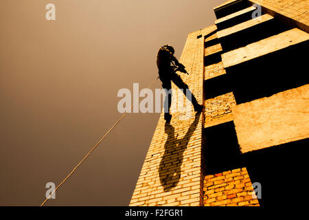 rappeling with weapons Stock Photo