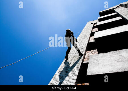 rappeling with weapons Stock Photo