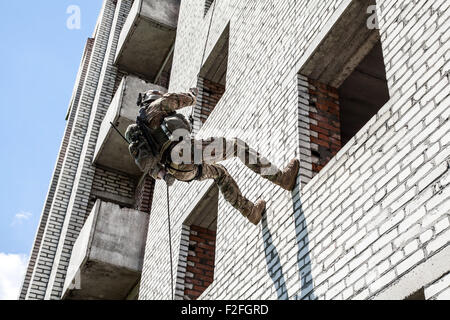 rappeling with weapons Stock Photo