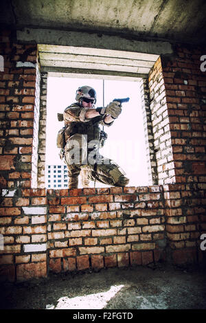rappeling with weapons Stock Photo