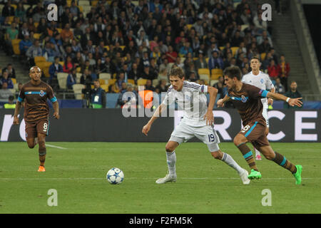 Kiev, Ukraine. 16th Sep, 2015. Denys Garmash (C) of Dynamo vies for a ball with Ruben Neves (R) of Porto during the UEFA Champions League Group G stage football match between FC Dynamo Kyiv and FC Porto at NSK Olimpiyskyi Stadium. © Sergii Kharchenko/Pacific Press/Alamy Live News Stock Photo