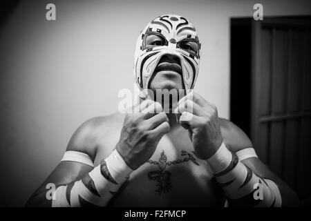 Mexico City, Mexico. 8th Sep, 2015. Luchador Triton prepares prior to the lucha libre at Arena Mexico in Mexico City, capital of Mexico, on Sept. 8, 2015. Lucha Libre is authentic Mexican free wrestling and features strong men in mysterious and elaborate masks. Triton, 28 years old, is considered one of the young promises of the World Wrestling Council for Lucha Libre. Arena Mexico, also known as the 'Cathedral of Lucha Libre', is the biggest arena in the country for this kind of matches. In 2015, Arena Mexico will host the 82nd anniversary of the CMLL. © Pedro Mera/Xinhua/Alamy Live News Stock Photo