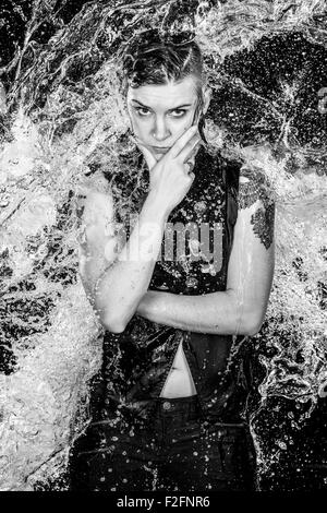 Angry Woman in Water Splashes in Monochrome Stock Photo