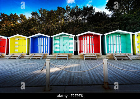 Coloured Beach huts at Colwell Bay, in the west of the Isle of Wight located between the towns of Totland and Yarmouth. Stock Photo