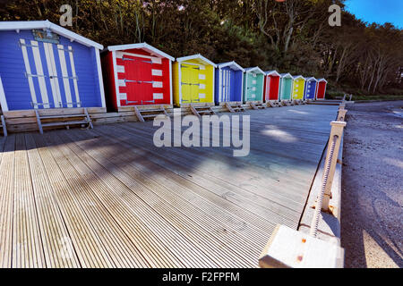 Coloured Beach huts at Colwell Bay, in the west of the Isle of Wight located between the towns of Totland and Yarmouth. Stock Photo