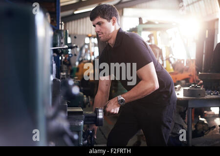 Mechanic working in auto repair shop Stock Photo