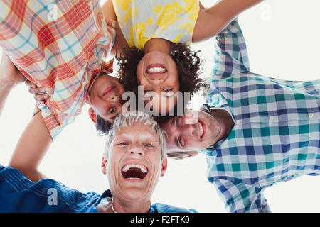Portrait smiling multi-generation family in huddle Stock Photo