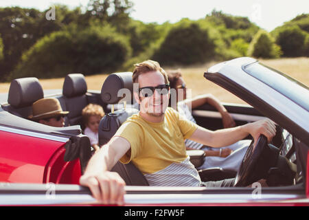 Portrait smiling man in convertible with family Stock Photo