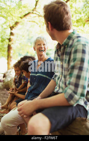 Mother and son laughing in woods Stock Photo