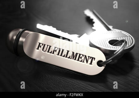 Fulfillment Concept. Keys with Keyring on Black Wooden Table. Closeup View, Selective Focus, 3D Render. Black and White Image. Stock Photo