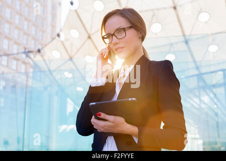 Businesswoman talking on mobile phone Stock Photo
