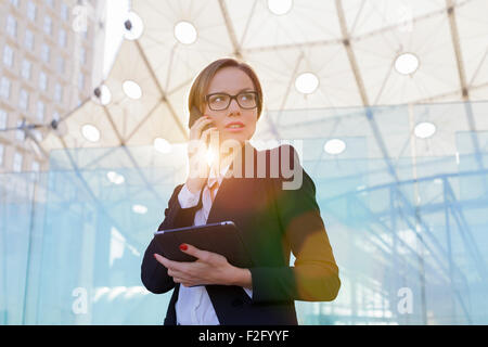 Businesswoman talking on mobile phone Stock Photo