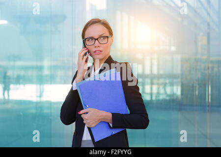 Businesswoman talking on mobile phone Stock Photo