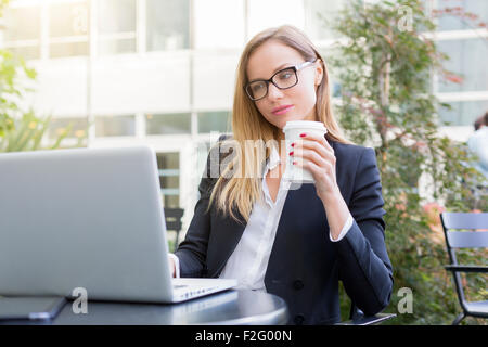 Businesswoman having a coffee break Stock Photo