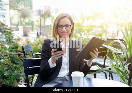 Businesswoman having a coffee break Stock Photo