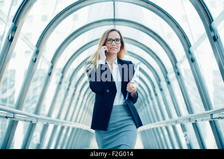 Businesswoman talking on mobile phone Stock Photo