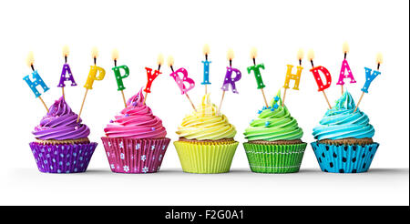 Row of colorful birthday cupcakes isolated on a white background Stock Photo