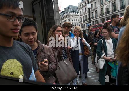 Shoppers on Regent Street, one of the main shopping streets in the West End of London. UK Stock Photo