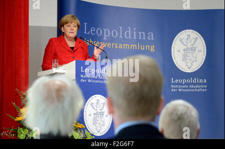 Halle, Germany. 18th Sep, 2015. German Chancellor (CDU) Angela Merkel gives a key note address at the annual meeting being held at the Leopoldina German National Academy for Sciences in Halle, Germany, 18 September 2015. The event this year is being held under the title 'Symmetry and asymmetry in science and art' Photo: HENDRIK SCHMIDT/DPA/Alamy Live News Stock Photo