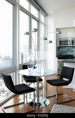 Modern dining room in city apartment Stock Photo
