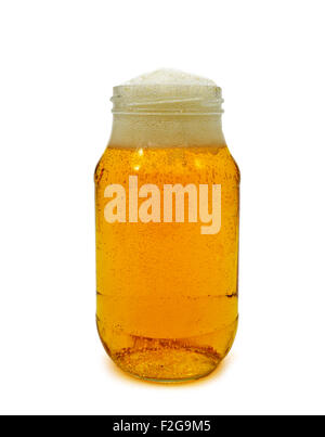 refreshing beer served in a glass jar on a white background Stock Photo