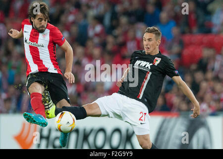 Bilbao, Spain. 17th Sep, 2015. Dominik Kohr (R) of Augsburg and Benat Extebarria of Bilbao vie for the ball during the UEFA Europa League Group L soccer match between Athletic Bilbao and FC Augsburg at Estadio de San Mames in Bilbao, Spain, 17 September 2015. Photo: Juan Flor/dpa/Alamy Live News Stock Photo