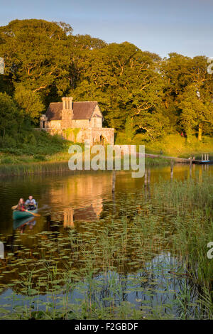 Canoeing below the Crom Castle Boathouse along Upper Lough Erne, Northern Ireland, UK Stock Photo