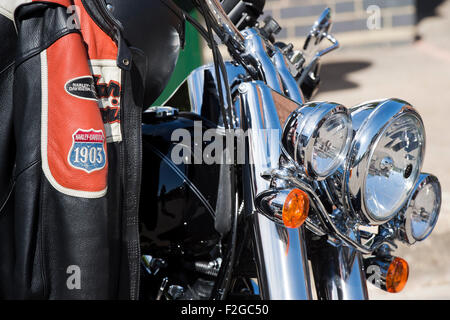 Harley Davidson motorcycle jacket hanging on a harley. UK Stock Photo