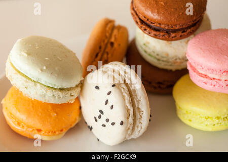 various macaroons flavors and colors of macaroons, on a white background Stock Photo
