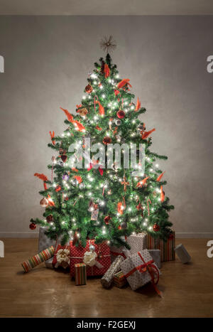 Beautiful illuminated christmas tree in a living room Stock Photo
