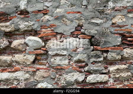 Old weathered stone wall for background or texture Stock Photo