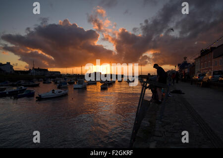 Sunset with clouds over Aberaeron harbour, Wales. Stock Photo