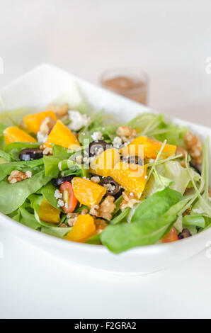 rocket salad with Parmesan cheese and orange fruit Stock Photo