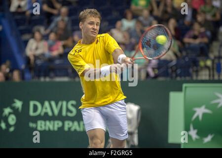 Vilnius, Lithuania. 18th Sep, 2015. Ricardas Berankis of Lithuania returns the ball to Vladyslav Manafov of Ukraine during the first round match of the Davis Cup Group I Europe/Africa Zone play-off between Lithuania and Ukraine in Vilnius, Lithuania, Sept. 18, 2015. © Alfredas Pliadis/Xinhua/Alamy Live News Stock Photo