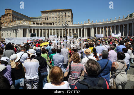 Crowds of people gathered in St Peters Square in the Vatican on a Sunday morning to hear Pope Francis. Stock Photo