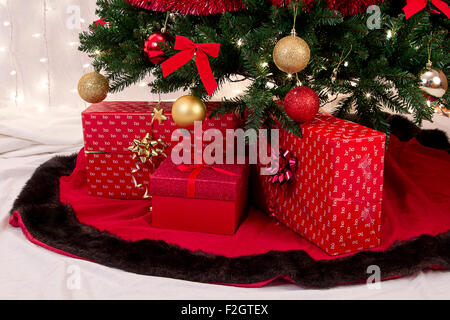 Decorated Christmas tree with presents under it. Stock Photo