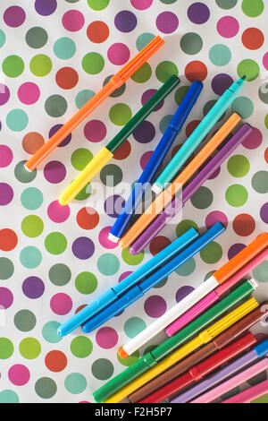 Pens on colorful circles background Stock Photo